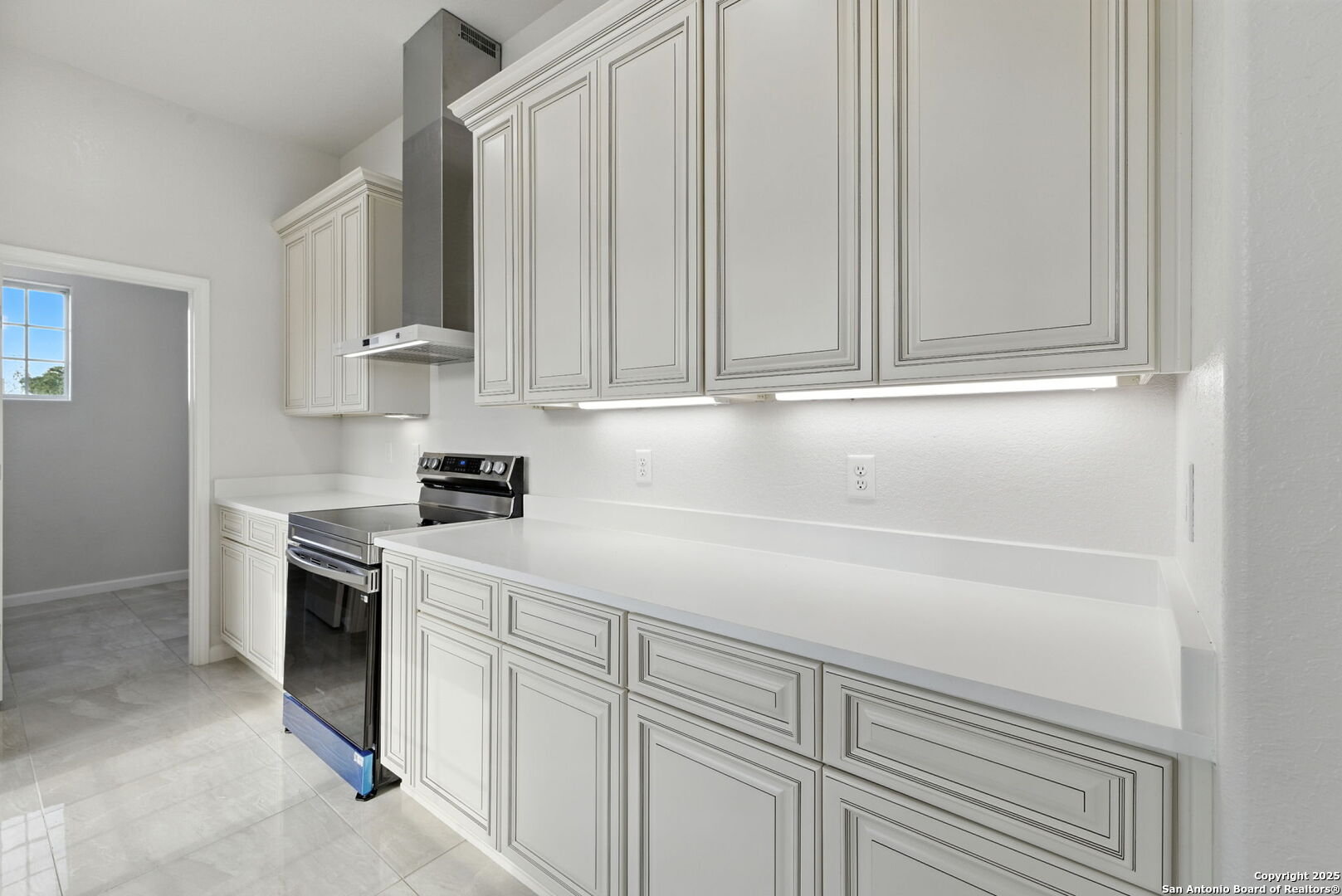 774 County Road 6843 Lytle, TX 78052 - Photo 30 of 63 a kitchen with white cabinets and white appliances