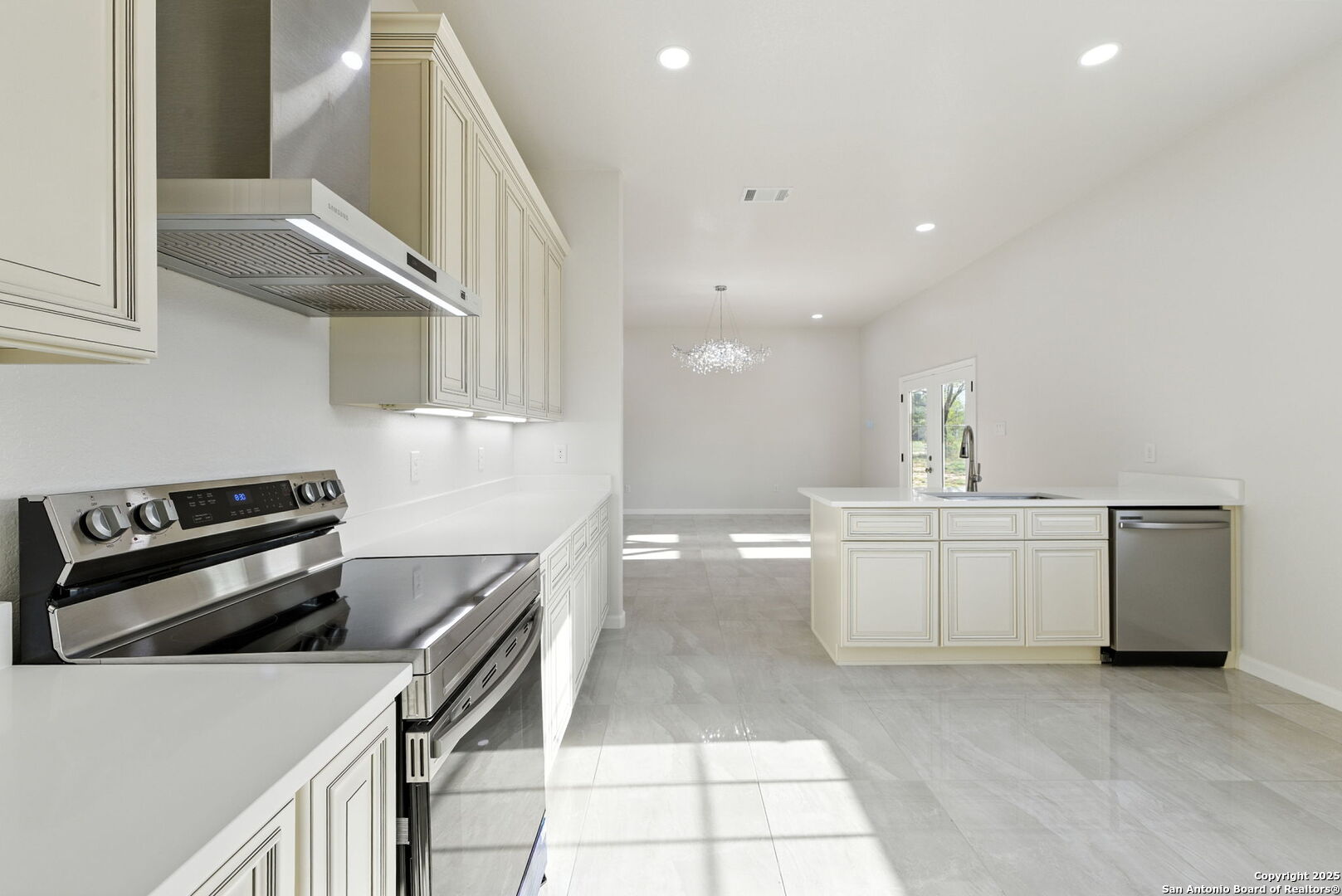 774 County Road 6843 Lytle, TX 78052 - Photo 32 of 63 a kitchen that has a sink and a stove