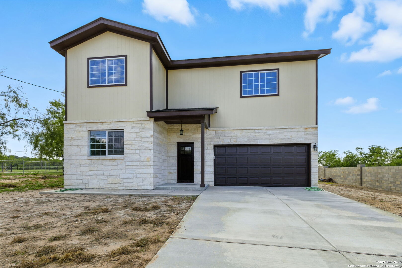 774 County Road 6843 Lytle, TX 78052 - Photo 4 of 63 a view of front of house with a yard