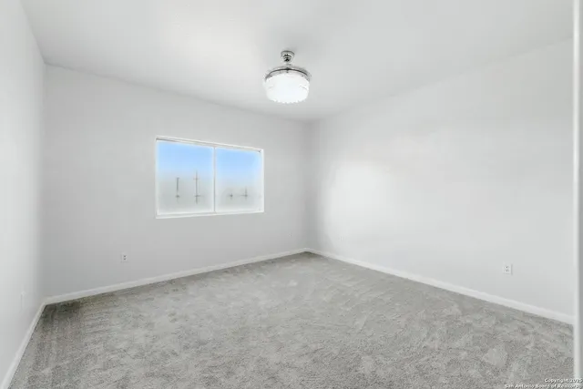 a aerial view of a house with a yard