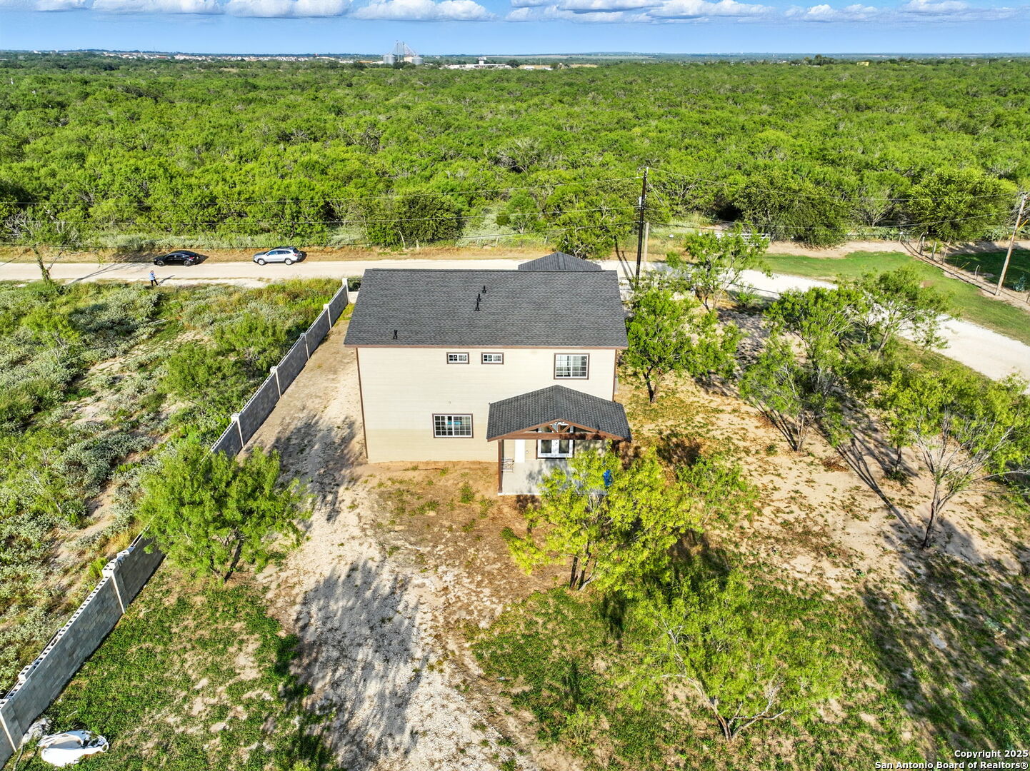 774 County Road 6843 Lytle, TX 78052 - Photo 58 of 63 a view of a garden with a building in the background