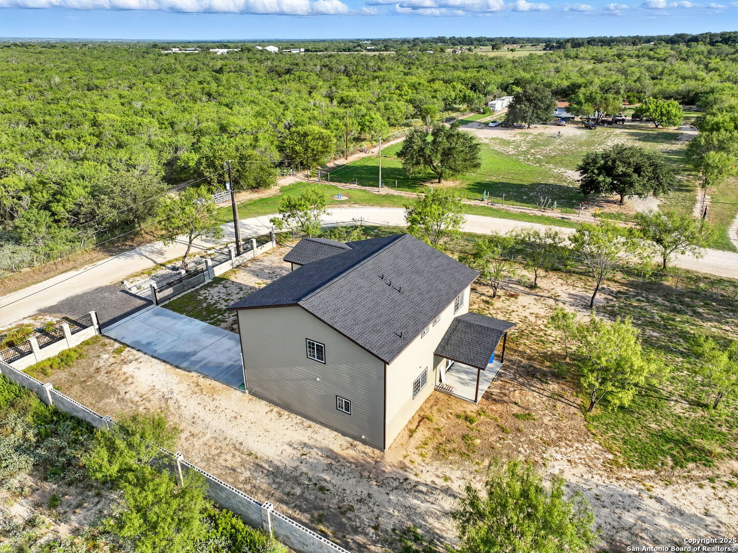 774 County Road 6843 Lytle, TX 78052 - Photo 59 of 63 a view of a house with a yard