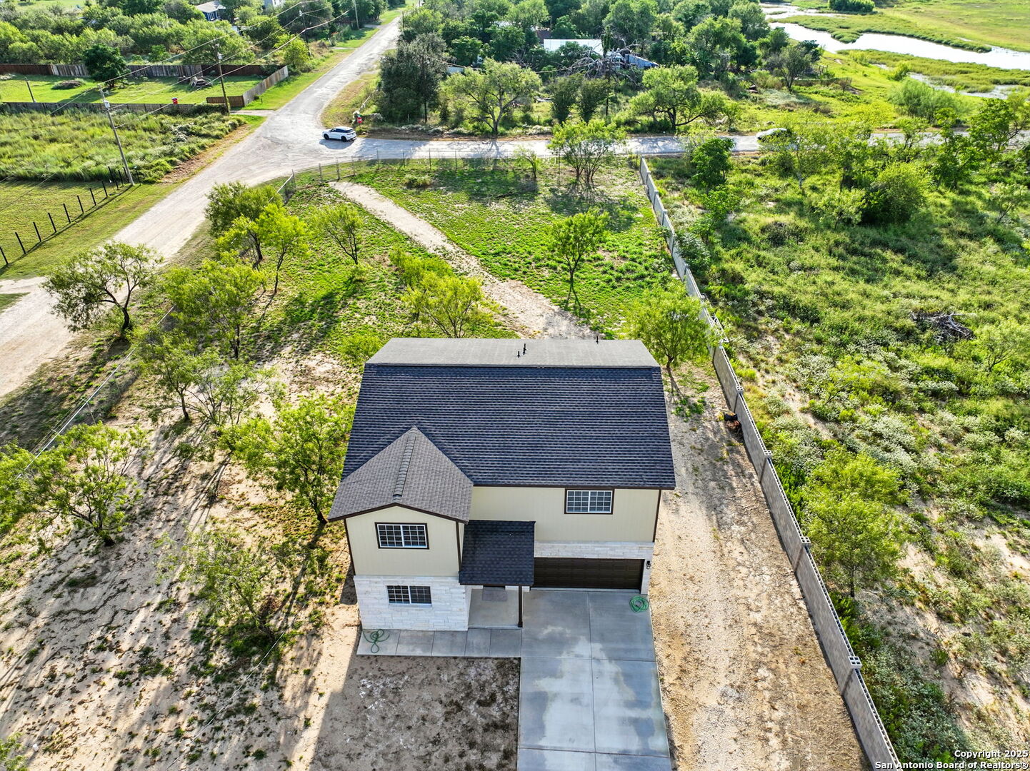 774 County Road 6843 Lytle, TX 78052 - Photo 60 of 63 a house with a yard