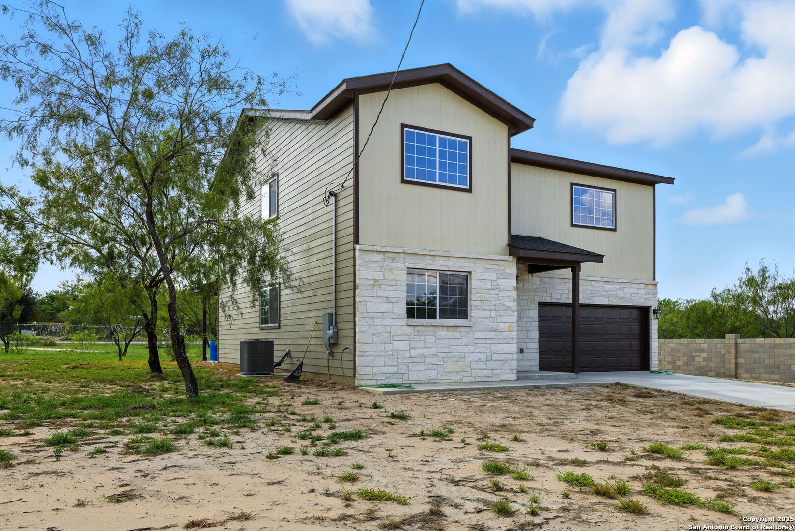 774 County Road 6843 Lytle, TX 78052 - Photo 6 of 63 a view of a house with a yard