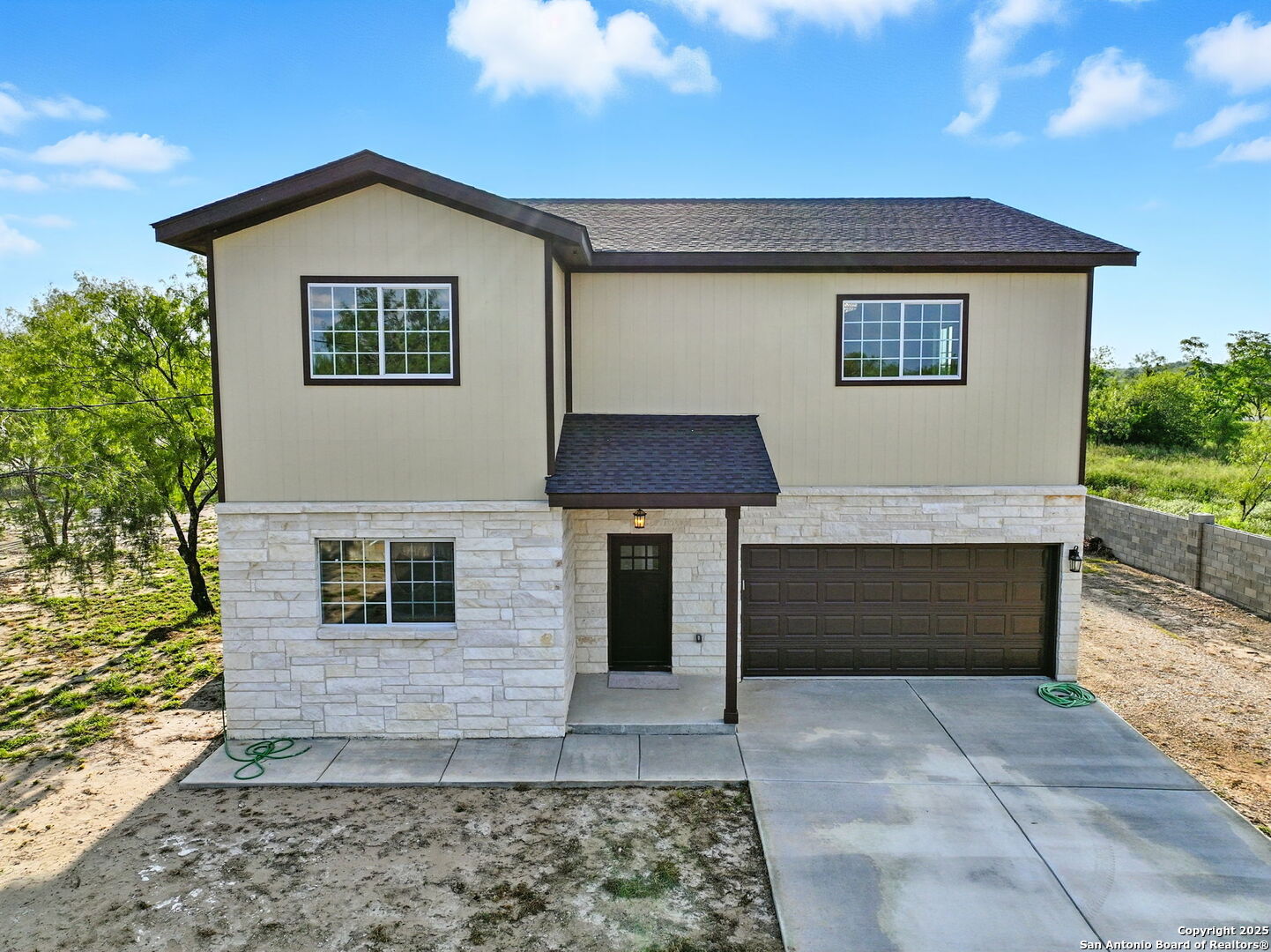 774 County Road 6843 Lytle, TX 78052 - Photo 62 of 63 a front view of a house with a yard