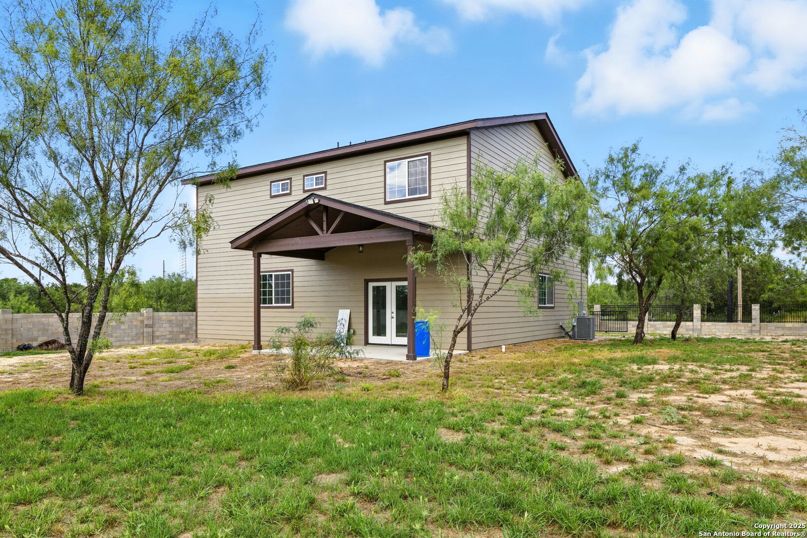 774 County Road 6843 Lytle, TX 78052 - Photo 8 of 63 a view of a house with a yard