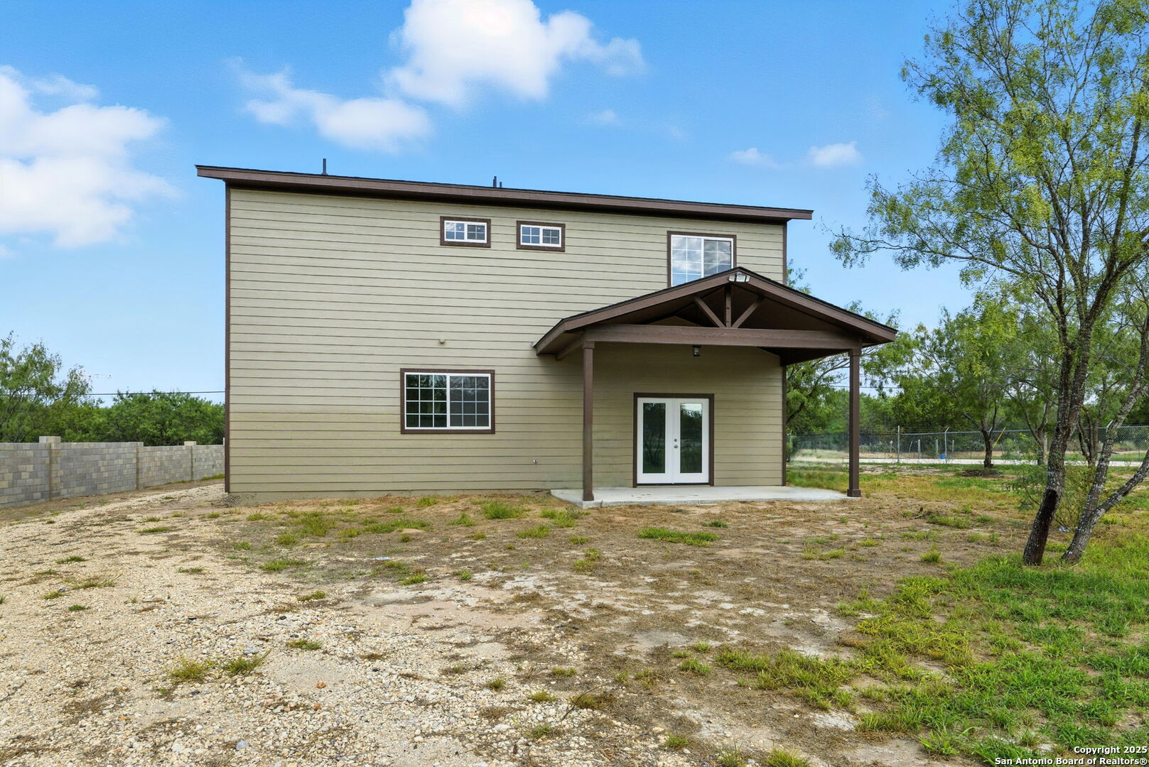 774 County Road 6843 Lytle, TX 78052 - Photo 9 of 63 a front view of a house with garden