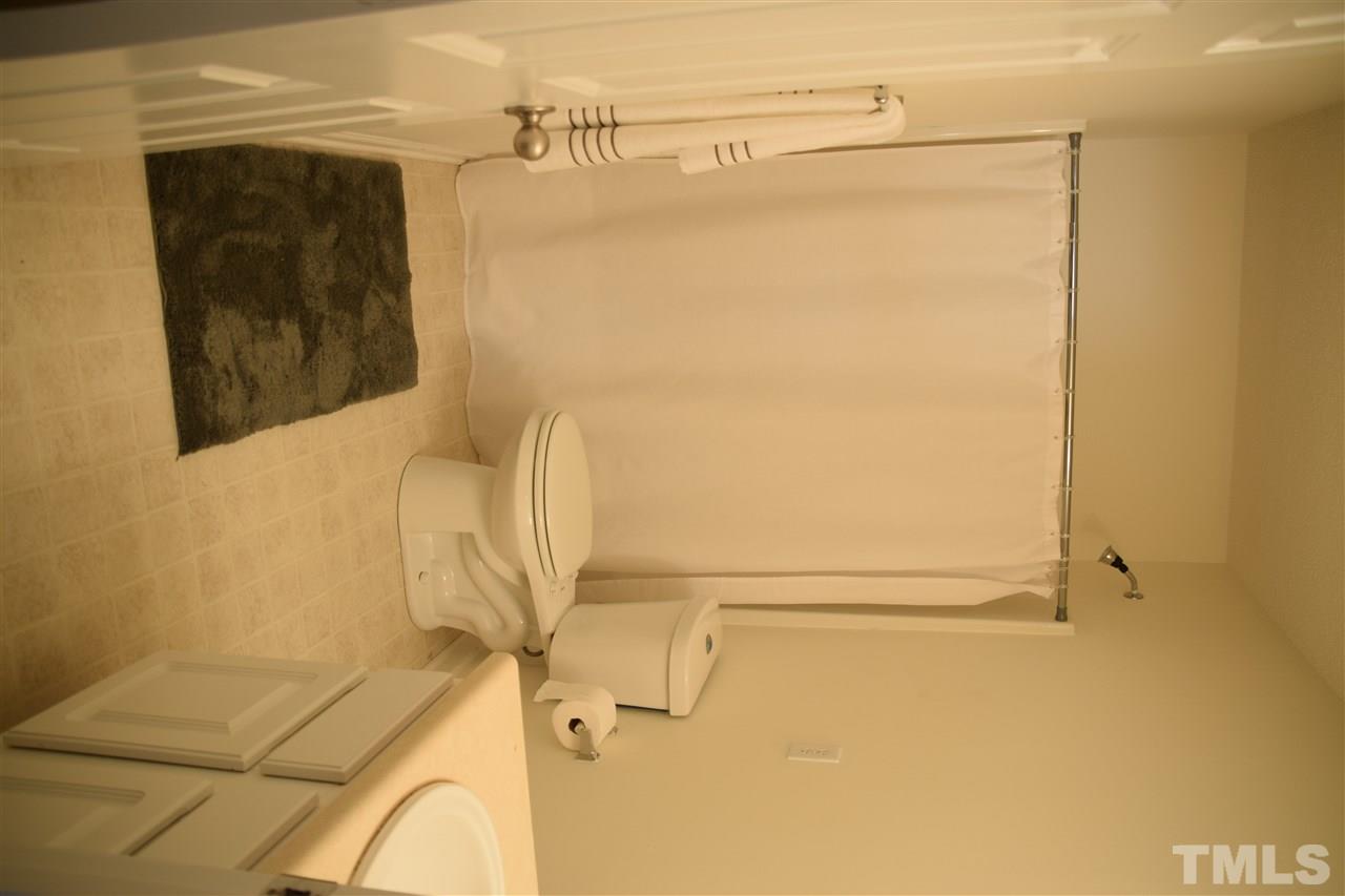 5918 Ricker Road Raleigh, NC 27610 - Photo 7 of 8 a bathroom with a shower