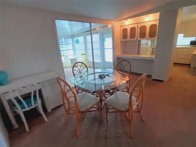 a bedroom with a bed and a table