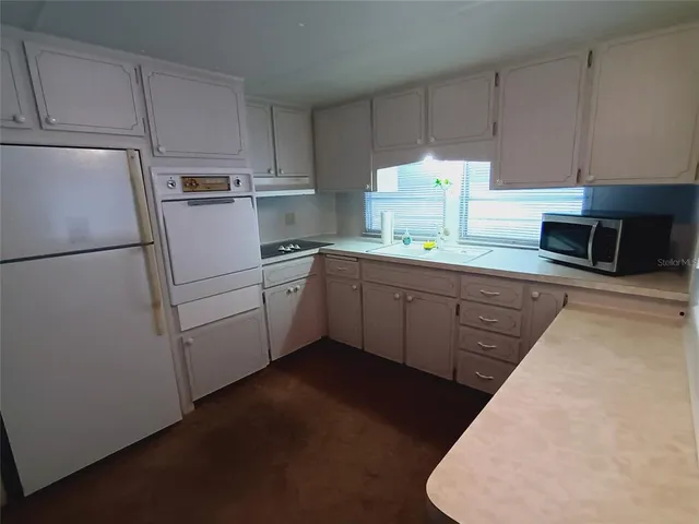 a bedroom with a bed and a curtain