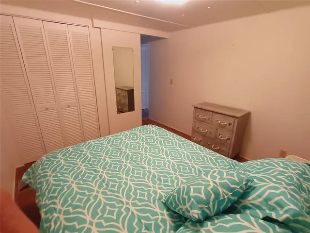 a kitchen with a stove top oven and refrigerator