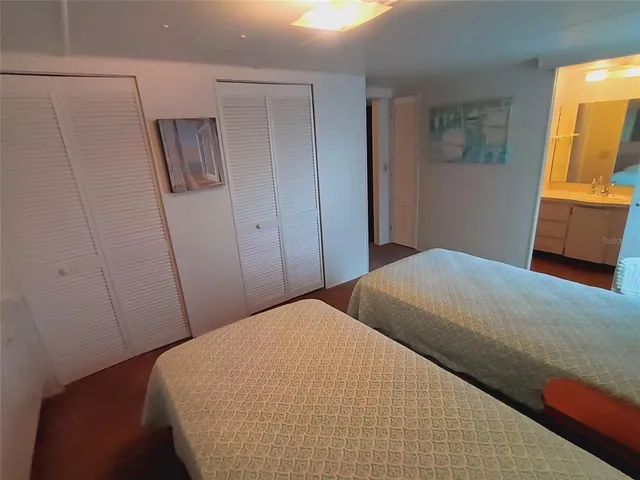 a living room with furniture a rug and a table