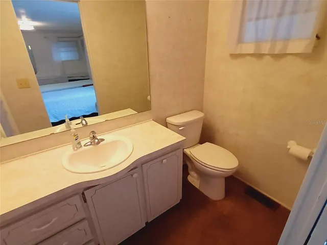 a outdoor dining space with furniture and a potted plant