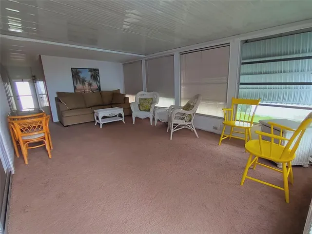 a living room with furniture and a gate