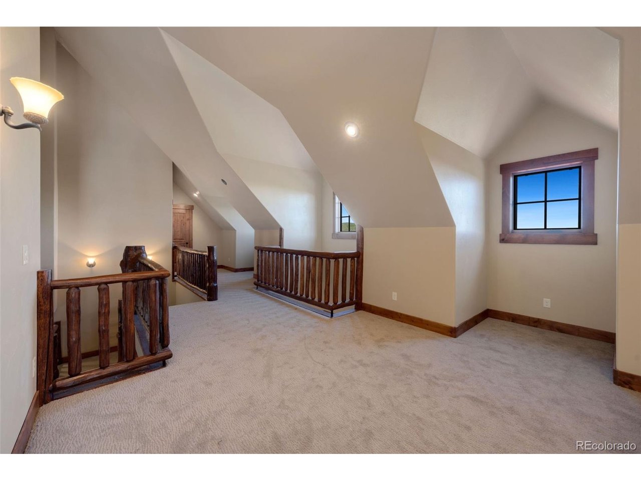 5200 Jackson Road Walden, CO 80480 - Photo 23 of 40 Vaulted windows to carry forward more natural light and log railing to tie it all together