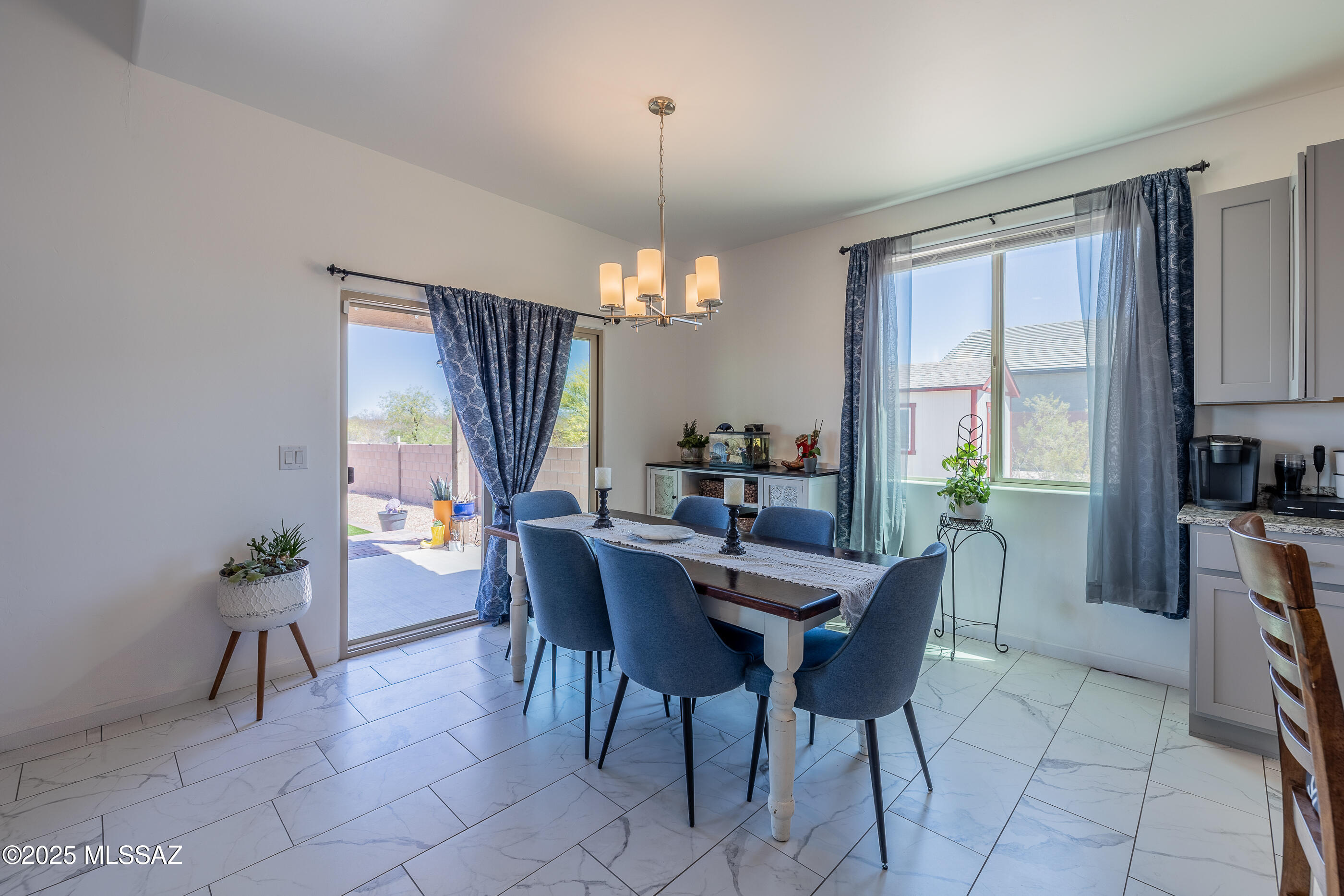 12123 Creosote Valley Road Vail, AZ 85641 - Photo 13 of 46 a view of a dining room with furniture and window