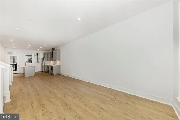 a view of a room with a kitchen