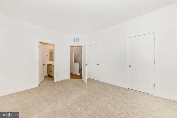 an empty room with closet area