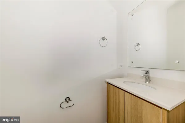 a bathroom with a sink and mirror