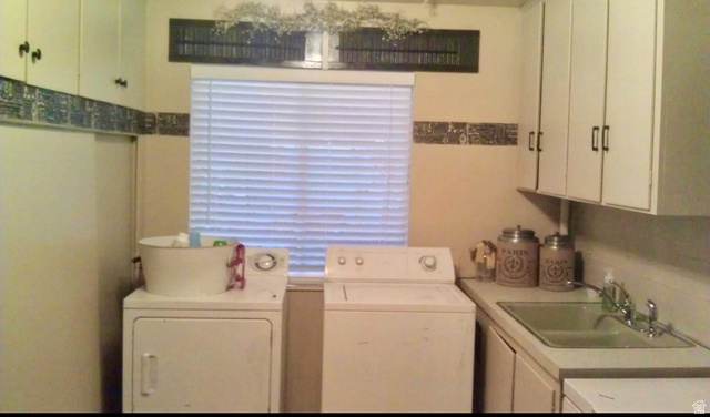 40 South State Street Scipio, UT 84656 - Photo 22 of 39 Laundry room featuring cabinet space and independent washer and dryer