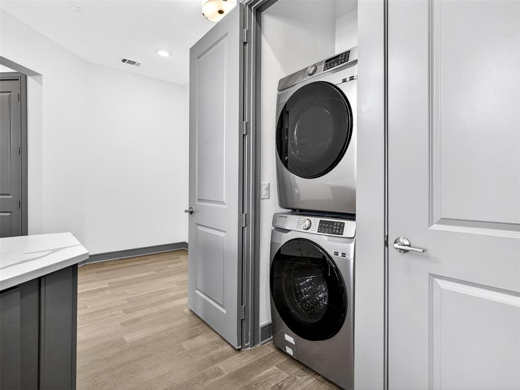 2700 Old Denton Road, Unit 3370 Carrollton, TX 75007 - Photo 23 of 35 a view of a hallway with washer and dryer