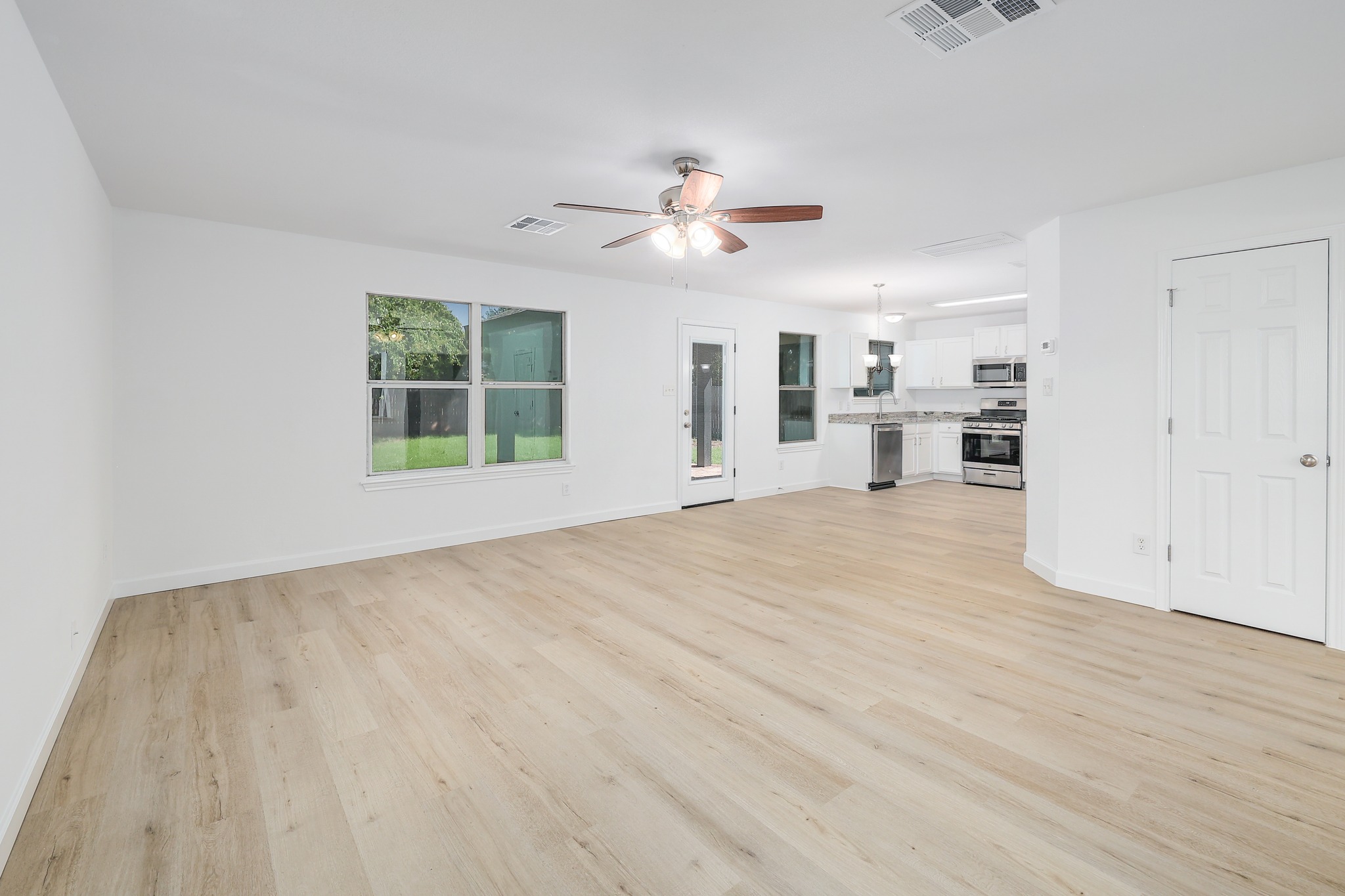 709 Los Robles Road Leander, TX 78641 - Photo 5 of 26 Family room with vinyl plank flooring