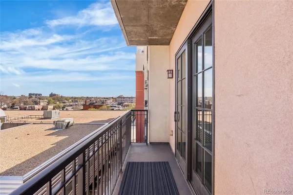 a balcony with view of city