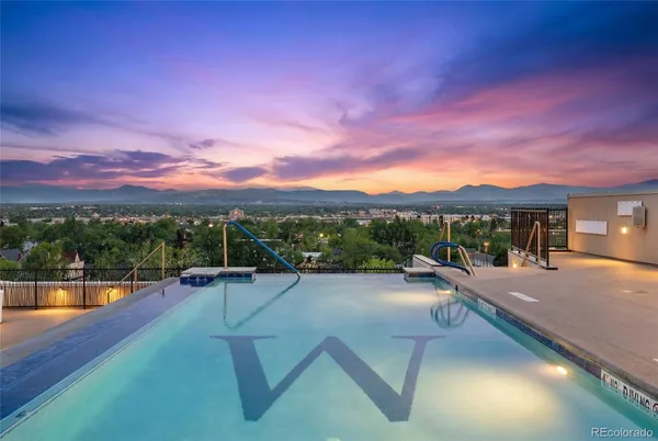 a view of a swimming pool with a patio