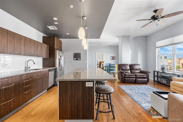a kitchen with counter top space a sink appliances and cabinets