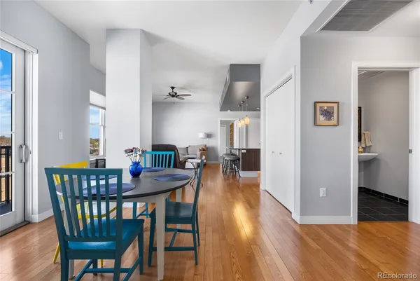 a view of a dining room with furniture and wooden floor