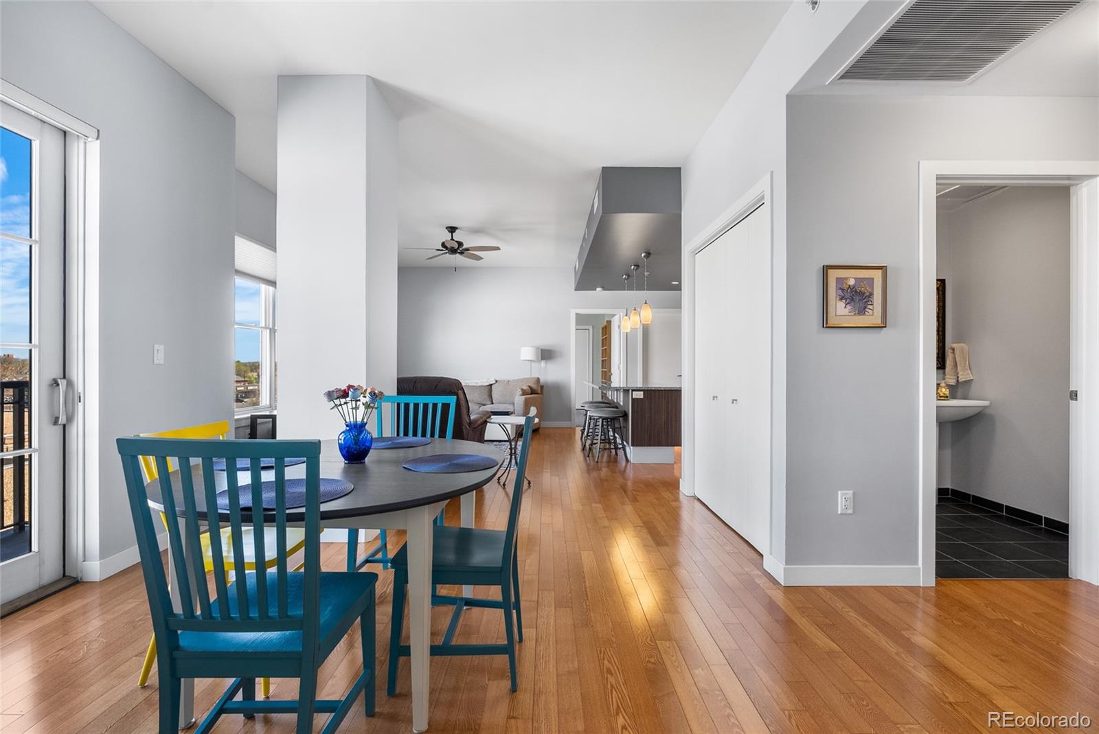 410 Acoma Street, Unit 511 Denver, CO 80204 - Photo 6 of 27 a view of a dining room with furniture and wooden floor