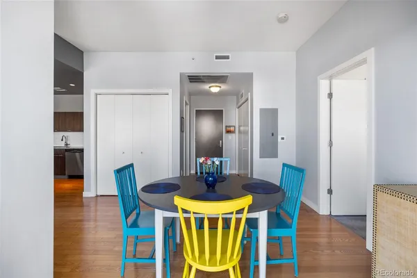 a view of a dining room with furniture and wooden floor