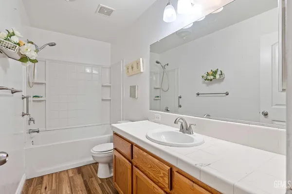a bathroom with a sink a toilet and a bathtub