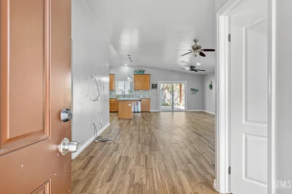 a view of a living room and wooden floor