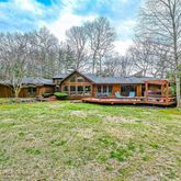 a front view of house with yard and seating area