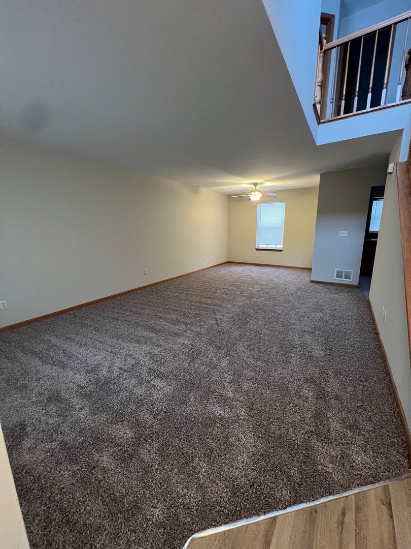655 Nichole Lane Geneva, IL 60134 - Photo 2 of 11 a view of a room with a fireplace