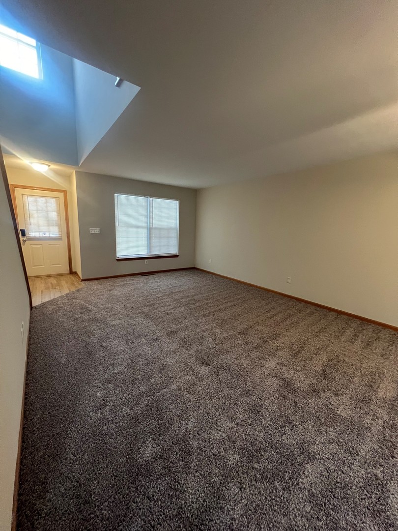 655 Nichole Lane Geneva, IL 60134 - Photo 9 of 11 an empty room with windows