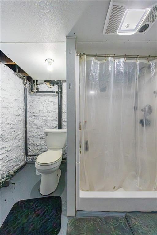 1470 Old Leechburg Road Pittsburgh, PA 15239 - Photo 17 of 25 a bathroom with a toilet and a shower