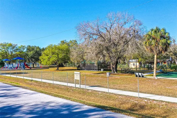 a view of a swimming pool with an outdoor space and seating area