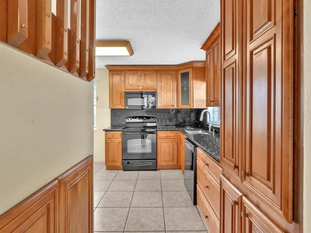 a en suite bathroom with a sink shower and a mirror
