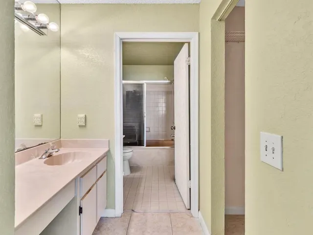 an aerial view of multiple houses with a yard