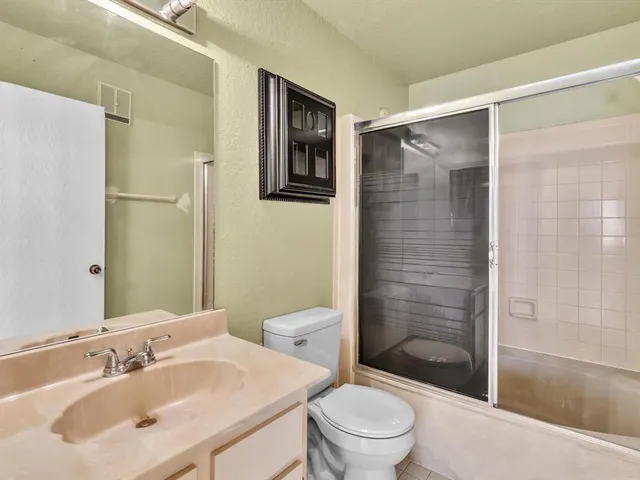 an aerial view of houses with yard