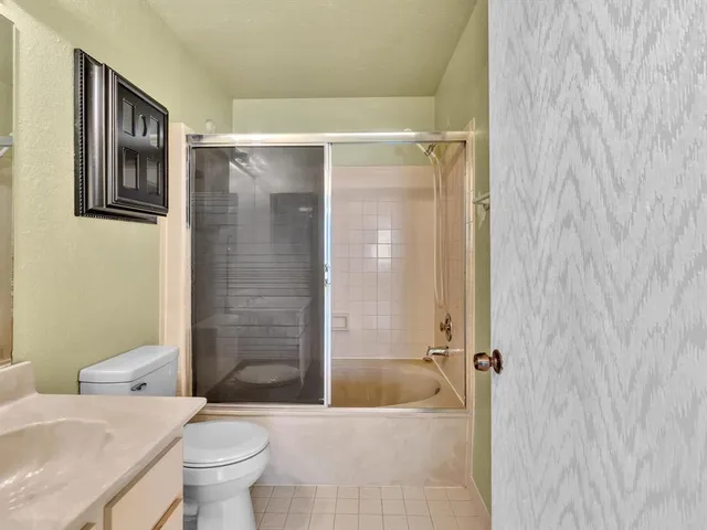 an aerial view of residential houses with outdoor space and street view