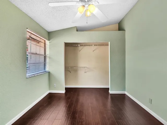 an aerial view of residential houses with outdoor space and street view