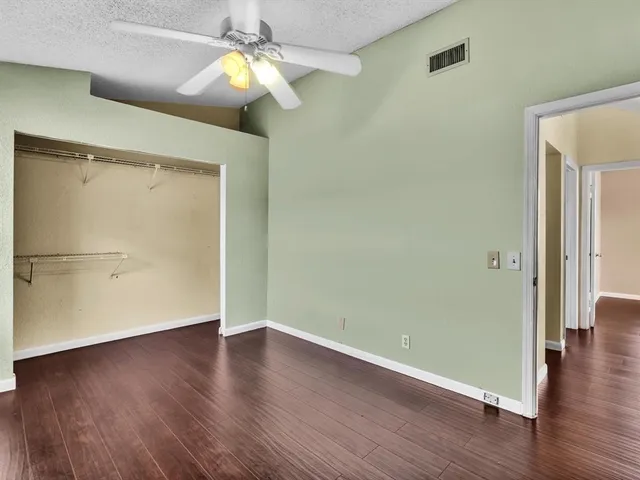 a view of swimming pool with outdoor seating and a garden
