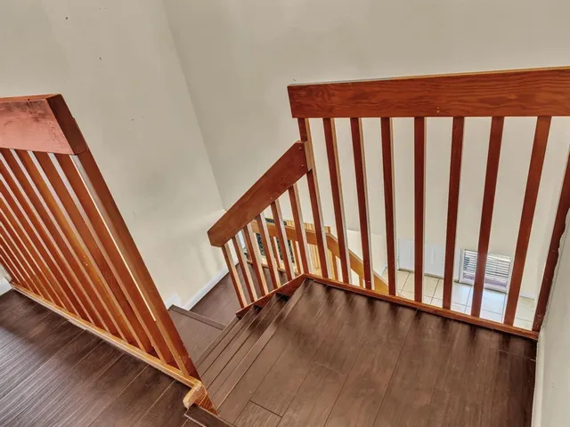 an aerial view of residential building and car parked