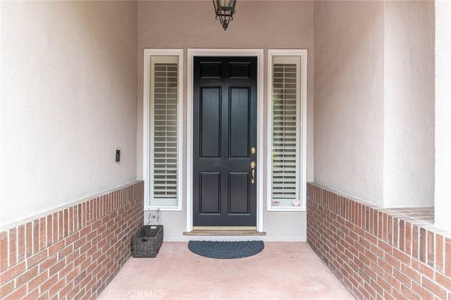 a view of a door and a window