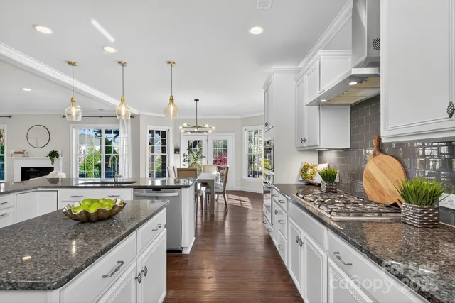 a kitchen with stove and cabinets