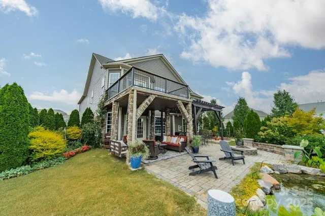 a view of a swimming pool with sitting area