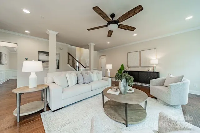 a living room with furniture and a large window